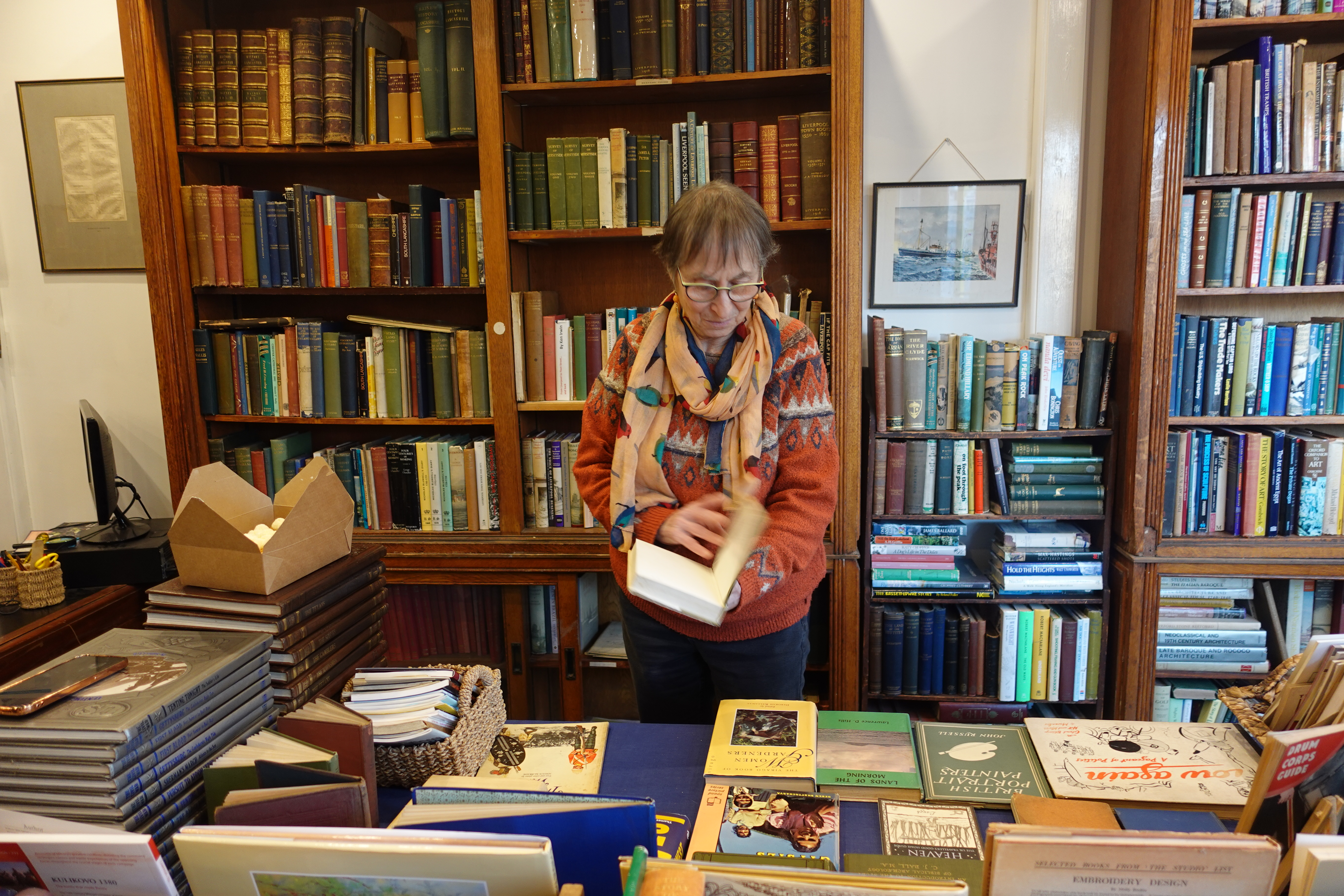 The counter and bookshelves inside Still Out-of-Print