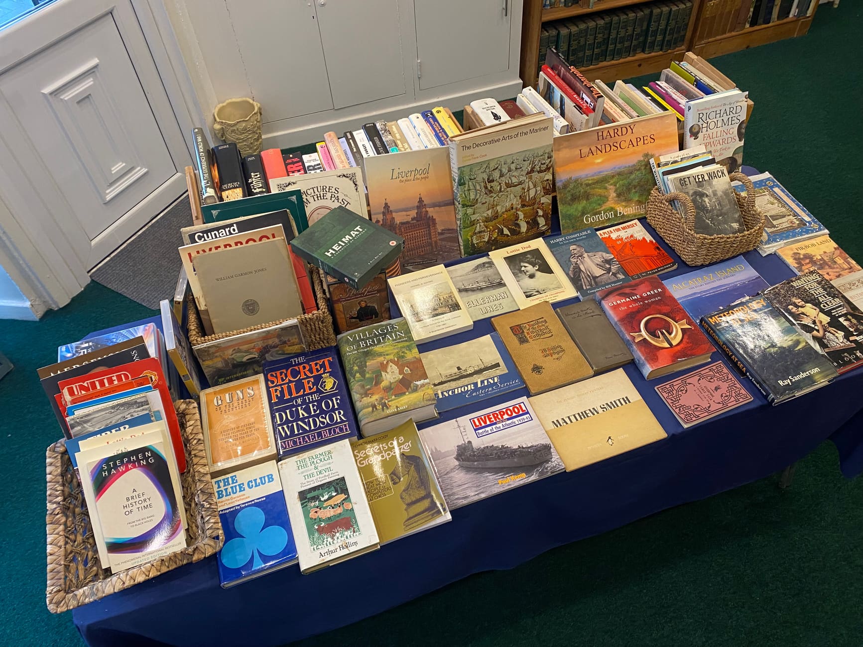 A table of new arrivals and secondhand books inside Still Out-of-Print